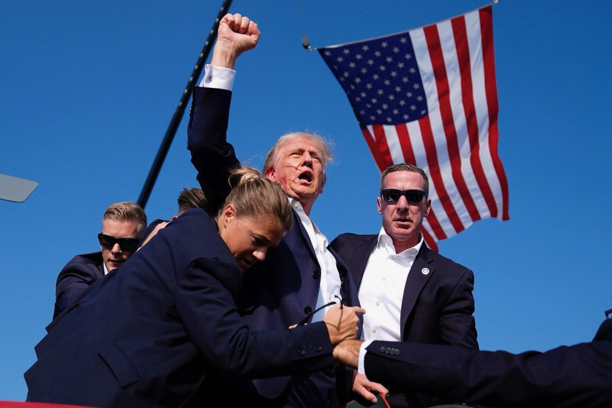 President Trump raising a fist after the assassination attempt